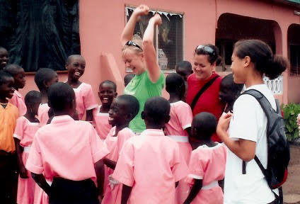 Andrea Facer Johnson with school children in Ghana